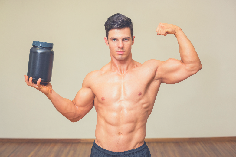 man takes a caffeine pre work workout supplement