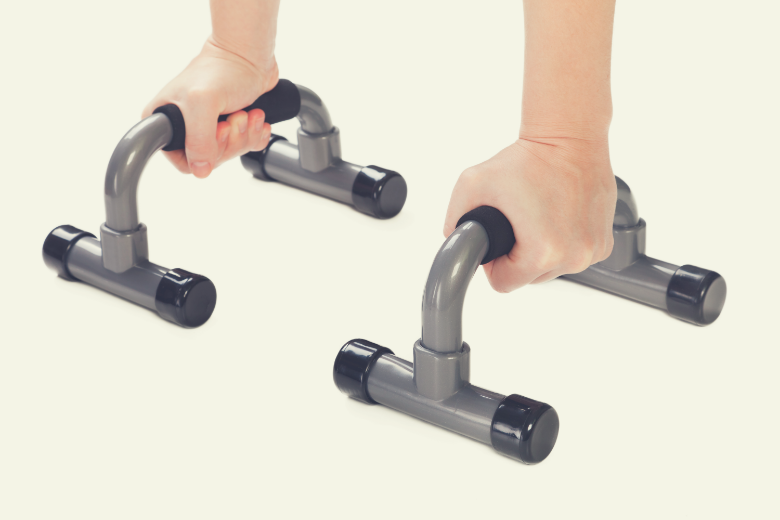 Adding push up stands to your home gym can help strengthen and sculpt your arms.