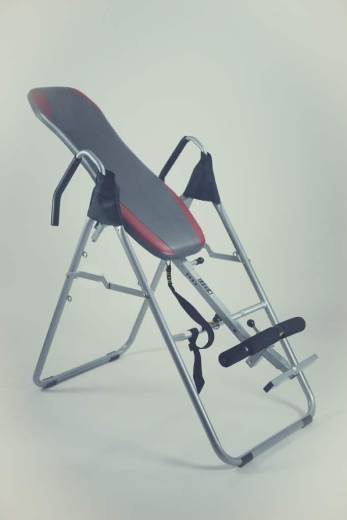 An inversion table for lower back pain works by using gravity to reduce pressure on your spine.