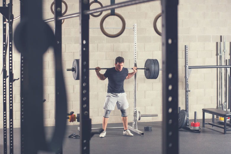 Using a squat rack for home gym is a great way to get a full body workout.